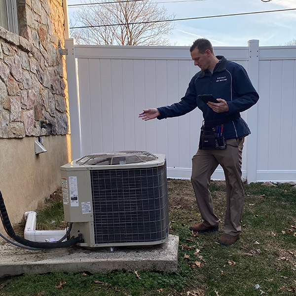 inspecting air conditioner Berks Realty Services in Southeastern PA